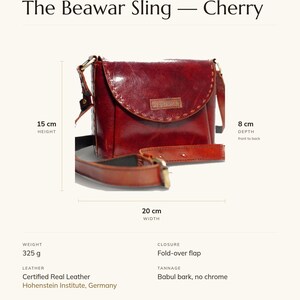 Specification card for The Beawar Sling in cherry: 20 cm wide, 15 cm high, 8 cm deep, 325 g, fold-over flap, full-grain leather, babul bark tannage. Made by Manish.