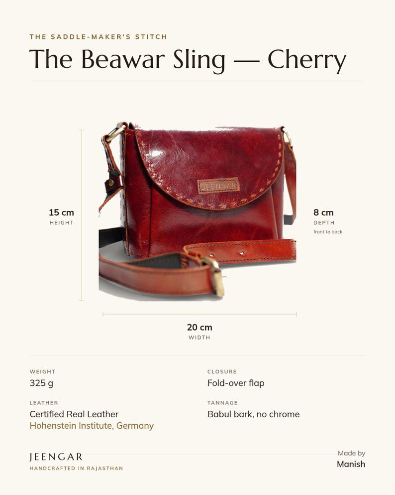 Specification card for The Beawar Sling in cherry: 20 cm wide, 15 cm high, 8 cm deep, 325 g, fold-over flap, full-grain leather, babul bark tannage. Made by Manish.