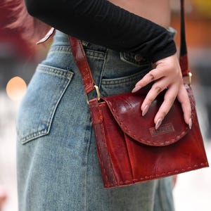 The Beawar Sling in Cherry, saddle-stitched real leather sling bag