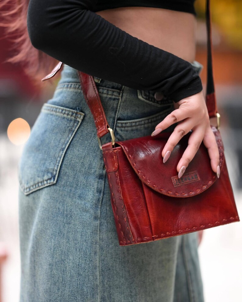 The Beawar Sling in Cherry, saddle-stitched real leather sling bag