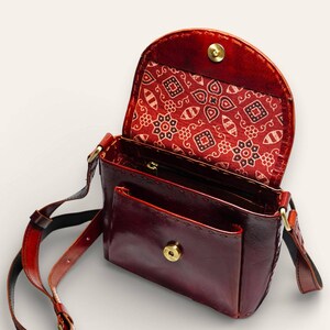 The Beawar Sling in Cherry, glossy leather sling bag by Jeengar