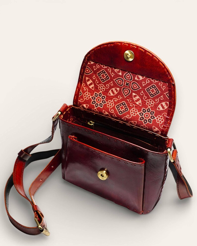The Beawar Sling in Cherry, glossy leather sling bag by Jeengar