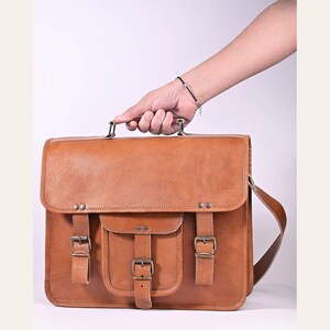 The Mewad Messenger carried by its top handle to show scale
