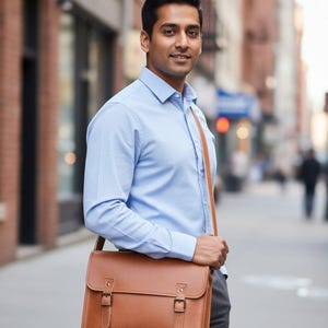 Man wearing The Jodhpur Messenger cross-body on a city street (AI-generated)