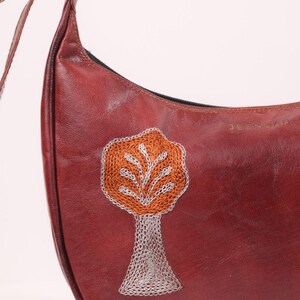 The Kashida Shoulder Bag, closeup of the hand-embroidered Padmini Tree of Life motif