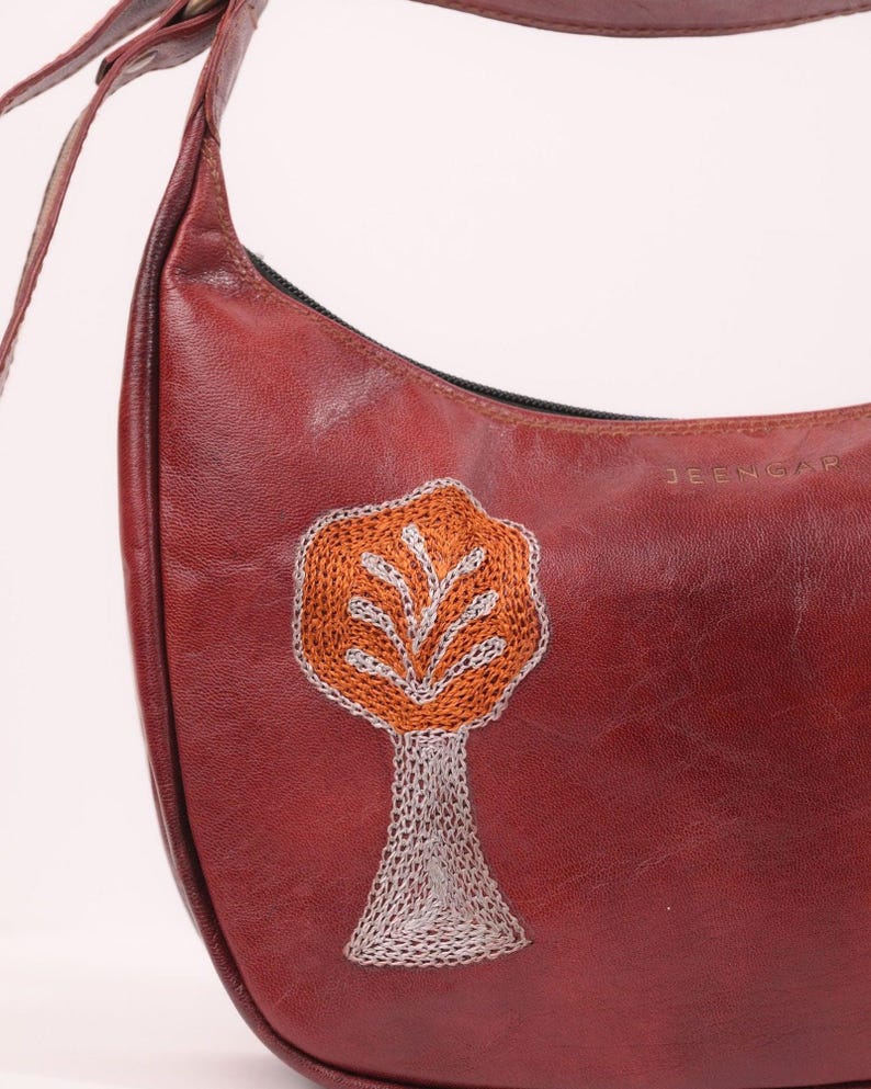 The Kashida Shoulder Bag, closeup of the hand-embroidered Padmini Tree of Life motif