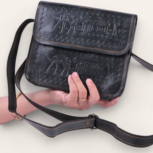 The Pushkar Sling in Dark Olive, embossed desert scene
