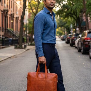 A man carrying The Mehrangarh Briefcase on a city street (AI-generated)