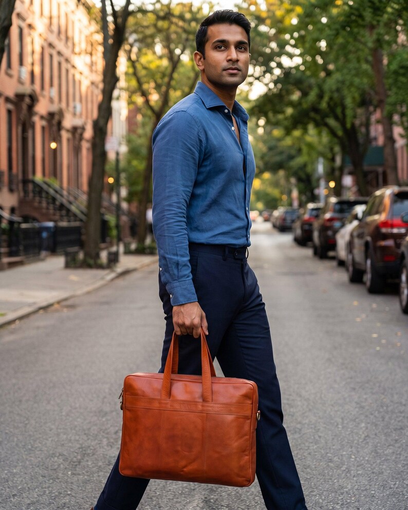 A man carrying The Mehrangarh Briefcase on a city street (AI-generated)