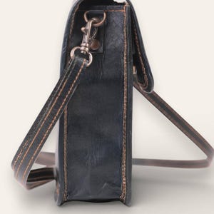 The Nagaur Sling in Dark Olive, full-grain leather mobile sling