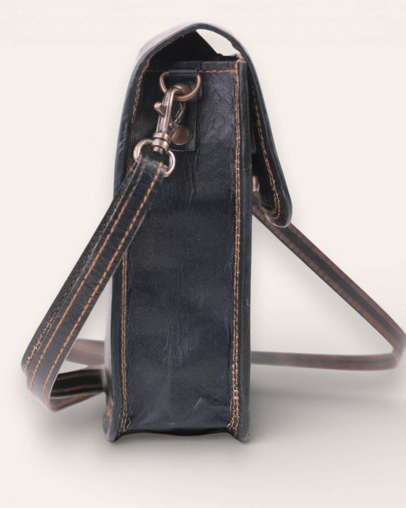 The Nagaur Sling in Dark Olive, full-grain leather mobile sling