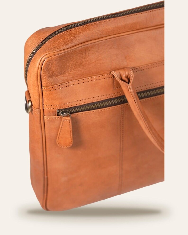 The Sonar Briefcase, three-quarter view showing the full-width front zip pocket