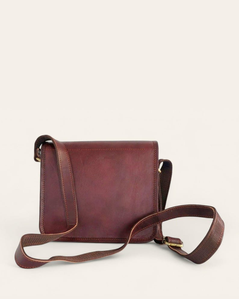 The Jaisalmer Sling in Cherry, back view with the leather strap and brass buckle adjuster