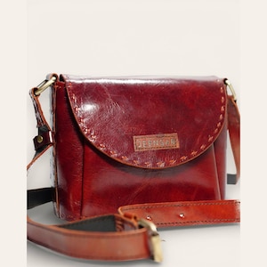 The Beawar Sling in Cherry, hand-stitched leather crossbody, front view