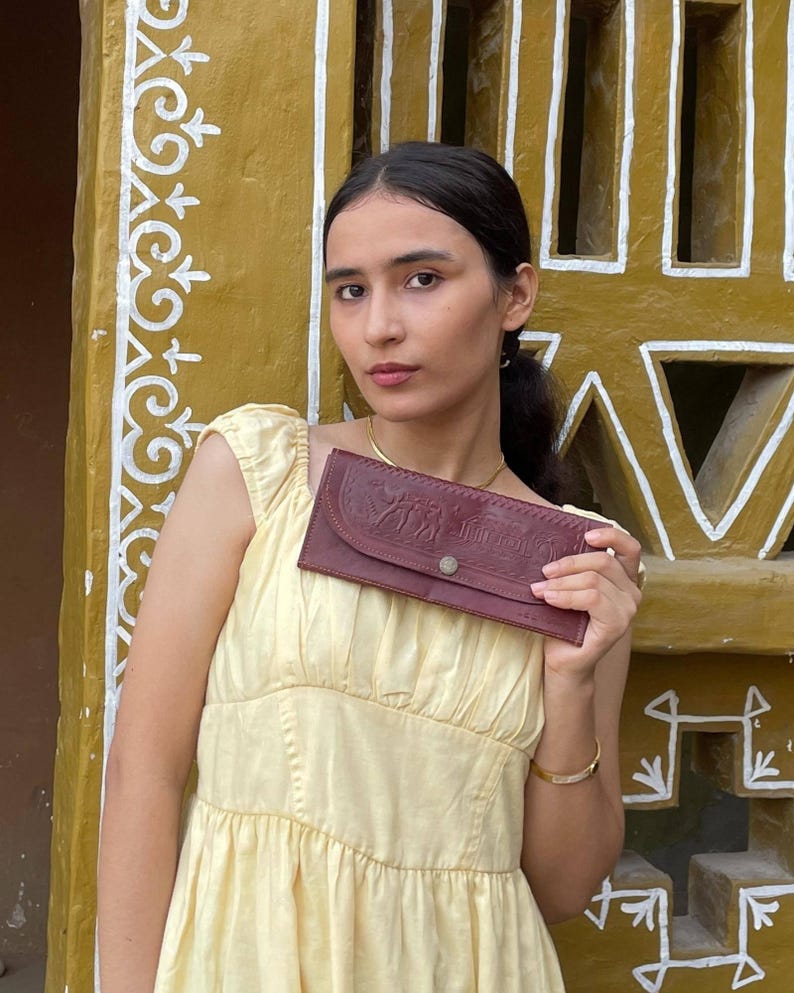 The Gangaur Clutch in Cherry, embossed camel and palm motif on real leather