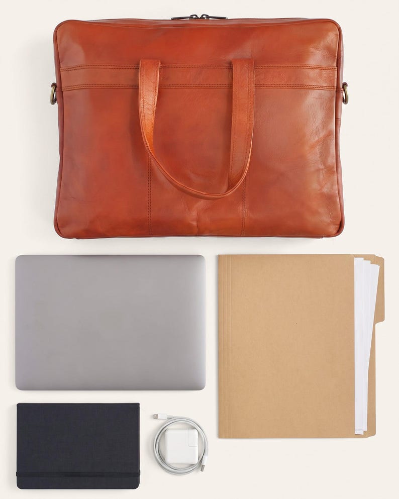 What fits inside The Mehrangarh Briefcase: a 15-inch laptop, document folder, notebook and charger (AI-generated)