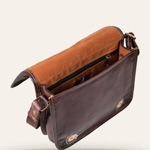The Moruda Sling opened, showing the velvet-lined interior and zip pocket