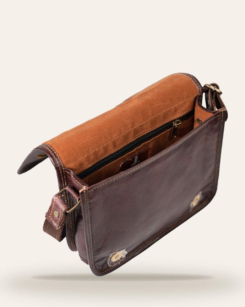 The Moruda Sling opened, showing the velvet-lined interior and zip pocket