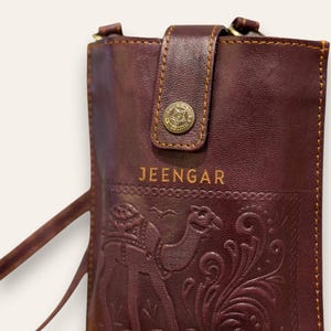 The Osian Mobile Sling, cherry red leather mobile sling, detail