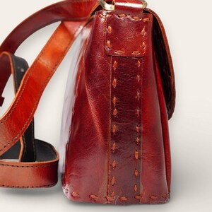 The Beawar Sling in Cherry, handcrafted leather sling by artisan Manish