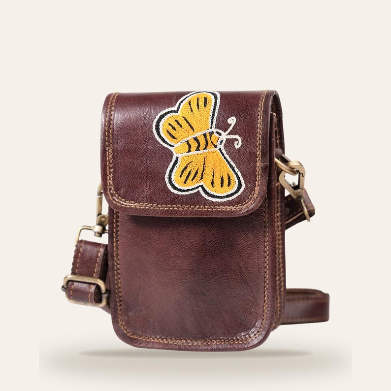 The Nagaur Kashidakari Sling in cherry brown, hand-embroidered butterfly on full-grain leather, front view