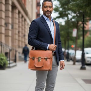 A man wearing The Malani Messenger crossbody, natural-brown leather messenger (AI-generated)