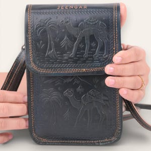 The Nagaur Sling in Dark Olive, embossed camel scene by artisan Mohan