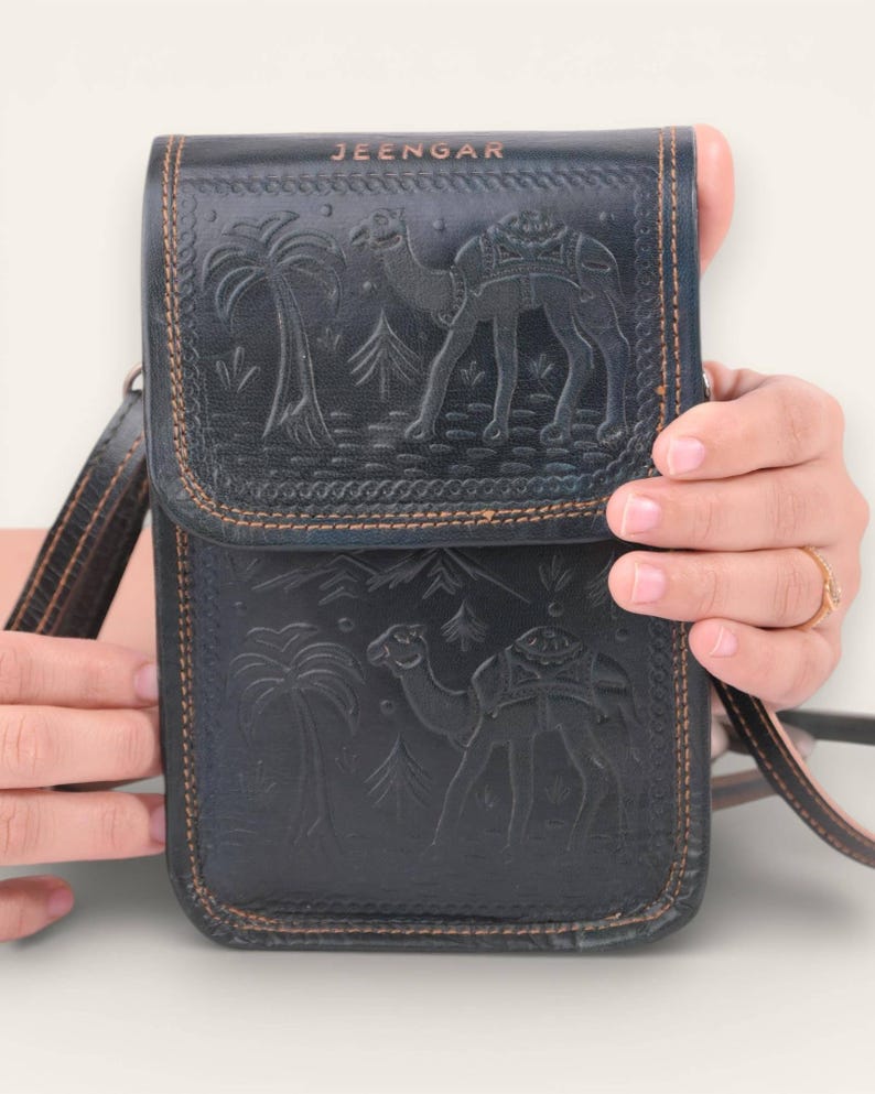 The Nagaur Sling in Dark Olive, embossed camel scene by artisan Mohan