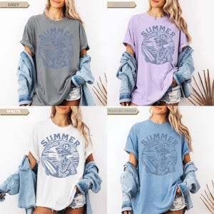 May include: Four t-shirts in grey, orchid, white, and washed denim. Each shirt features a circular graphic with the text "Summer Time" and a skeleton surfer design. The shirts have rolled sleeves and are paired with denim jackets.