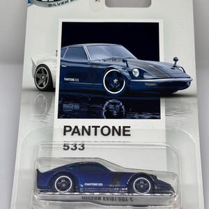 May include: A distressed white wooden sign displaying the word "Welcome" in a handwritten font. A small heart decoration is affixed below the text. The sign has a rustic appearance, with a blurred wooden background.