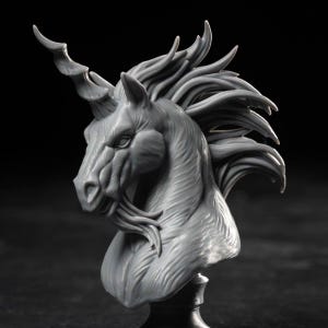 May include: A gray unicorn bust sculpture with a detailed mane and spiraled horn. The sculpture is set against a dark background, highlighting the intricate details of the mythical creature's face and neck. The sculpture is a decorative item.