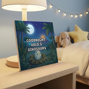 Goodnight Dinosaurs personalised book on a bedside table in a child's bedroom