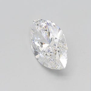 May include: A marquise-cut diamond with a brilliant, faceted surface. The colorless gemstone reflects light, showcasing its intricate internal structure. The elongated shape and pointed ends are characteristic of this diamond cut.