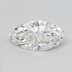 May include: A marquise-cut diamond with a brilliant, faceted surface. The colorless gemstone is set against a white background, showcasing its clarity and sparkle. The elongated shape of the diamond is prominent.
