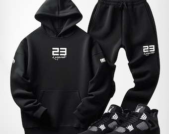 Conjunto deportivo negro Legend 23: sudadera con capucha y pantalón de chándal.