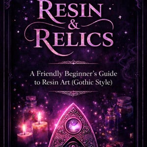 May include: A book cover with a dark purple background featuring the title "RESIN & RELICS" in a stylized font. The cover includes illustrations of candles, bottles, and a planchette. Text reads "A Friendly Beginner's Guide to Resin Art (Gothic Style)" and "by Ravens Relix (Maz)".