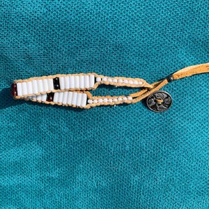 Glass wampum bracelet with genuine garnet beads woven onto leather deerskin lacing  BB-2