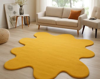 Alfombra moderna amarilla con forma de salpicadura: alfombra abstracta con manchas para sala de estar y sala de juegos.