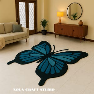 May include: A large, butterfly-shaped rug in shades of teal and black dominates the floor. The rug's design features detailed wing patterns and a central body, adding a decorative element to the room. The text "NOVA CRAFT STUDIO" is at the bottom.