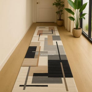 May include: A rectangular hallway rug with a geometric design in shades of beige, black, gray, and tan. The rug features a repeating pattern of rectangles and lines. The text "NOVACRAFTSTUDIO" is visible on the rug.