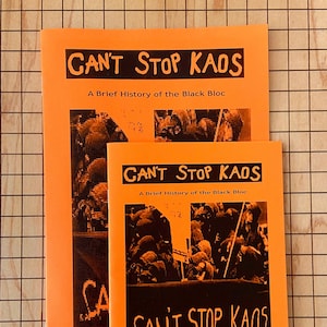 May include: Two orange pamphlets with the title "Can't Stop Kaos: A Brief History of the Black Bloc" and the text "Autonomous Resistance".