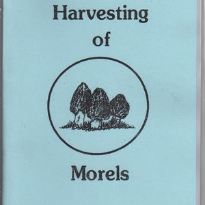 May include: A light blue booklet with the title "Harvesting of Morels Complete Field Guide" and a black and white illustration of three morel mushrooms.
