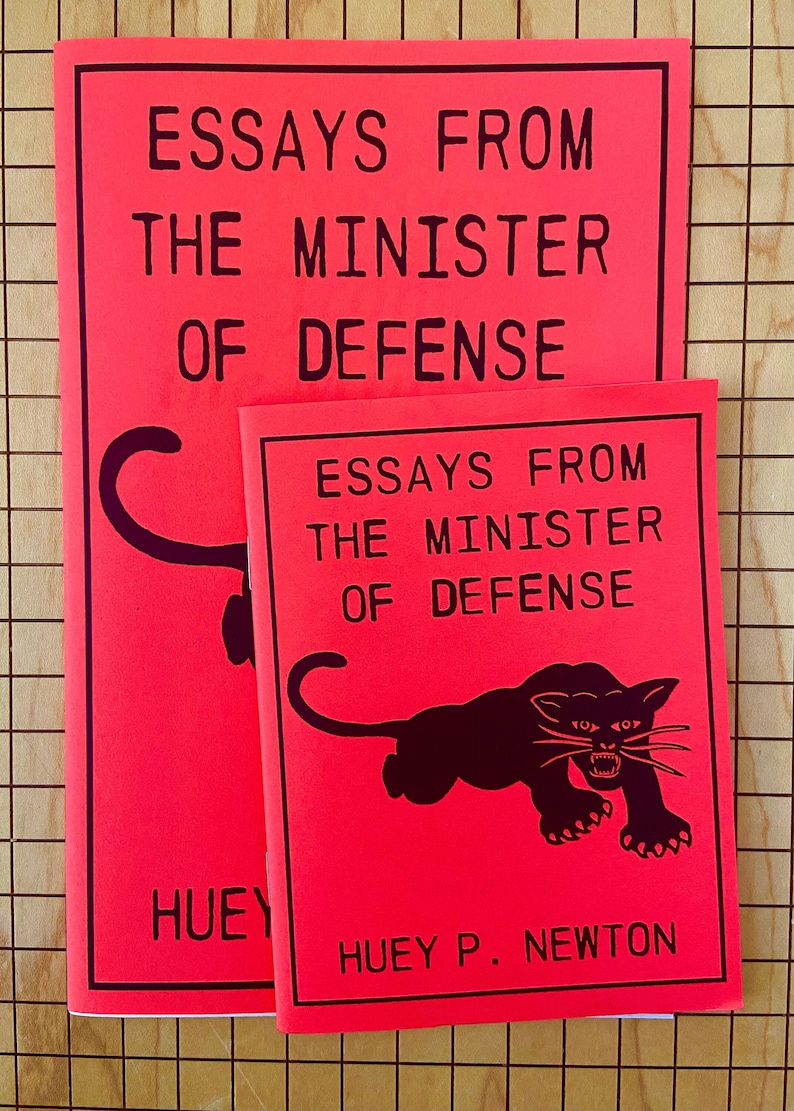 May include: Two red books with black text and a black panther illustration. The top book says "Essays From The Minister Of Defense". The bottom book says "Essays From The Minister Of Defense" and "Huey P. Newton".