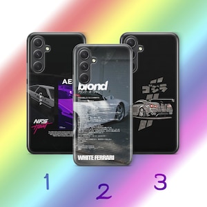 May include: Three black smartphone cases featuring automotive designs. The left case shows a white car with 'NFS Heat' text. The center case displays a white car with 'blond' and 'WHITE FERRARI' text. The right case features a grey car with Japanese text.