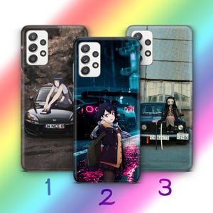 May include: Three smartphone cases featuring anime-style characters and cars. The first shows a character on a black car with licence plate 34 NCE 61. The second displays a character in a dark street setting. The third shows a character on a car with licence plate C 696 K 73 and 21-06.