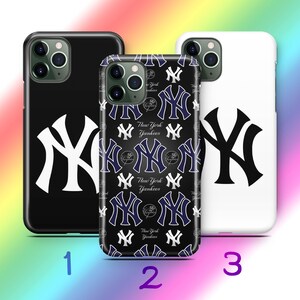 May include: Three phone cases displaying the New York Yankees logo. One is black with a white logo, another is white with a black logo, and the third is black with a repeating pattern of the logo and the words "New York Yankees".
