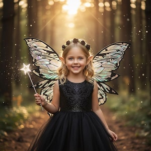 May include: A young person dressed as a fairy, wearing a black dress, butterfly wings, and a floral crown. They are holding a star-shaped wand. The background is a blurred forest scene with sunlight.