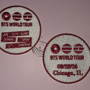 May include: Two embroidered patches with a circular design. The patches feature the text "BTS WORLD TOUR" and other graphics in red and white. One patch includes "08/28/26 Chicago, IL".