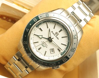 Reloj automático Grand Seiko GMT para hombre renovado. / Todo funcionando. / Reloj de acero inoxidable con esfera blanca.