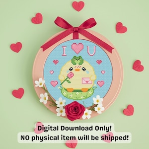 May include: A cross-stitch hoop art piece with a cute yellow chick holding a rose and a letter, surrounded by hearts. The text "I ❤️ U" is stitched above the chick. The hoop is decorated with a red bow, flowers, and red heart cutouts.